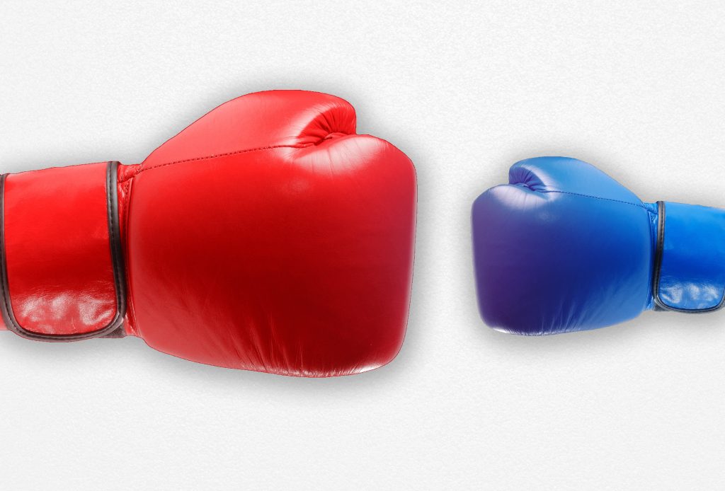 Decorative image of two boxing gloves; one much larger than the other representing the keyword "unfair"