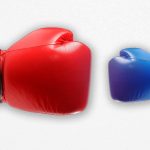 Decorative image of two boxing gloves; one much larger than the other representing the keyword "unfair"